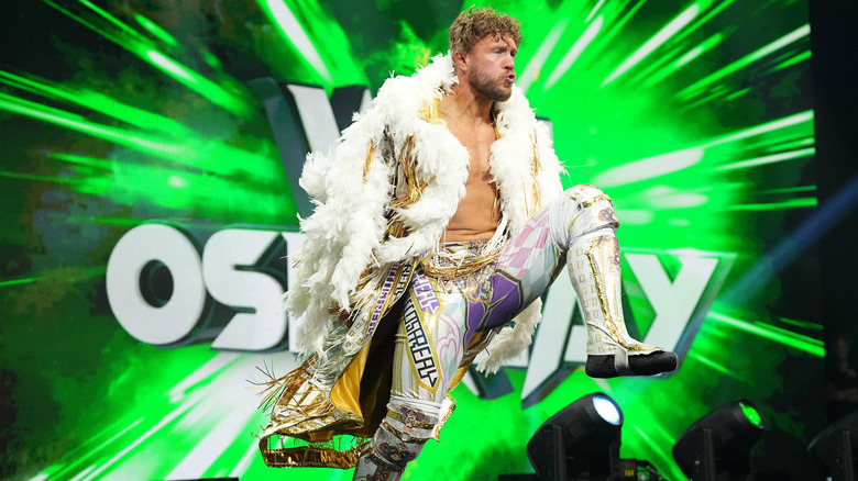 Will Ospreay stops on the stage while making his way to the ring for a match during an episode of 