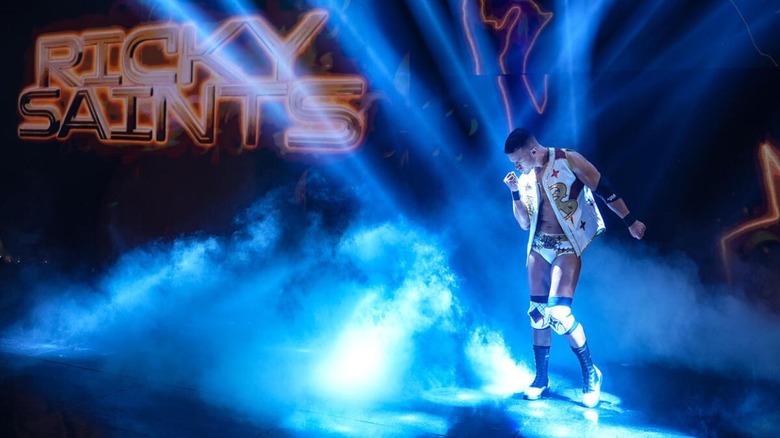 Ricky Saints hits his signature pose on the stage ahead of his debut match on "WWE SmackDown."