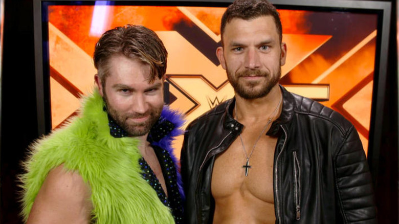 Tyler Breeze and Fandango smiling