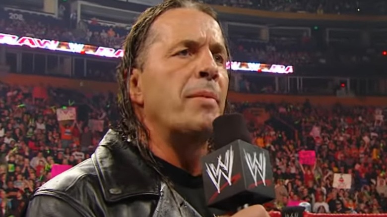 Bret Hart talking into microphone
