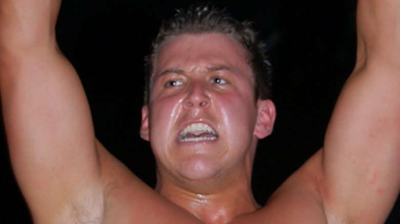 Brett DiBiase raises arms