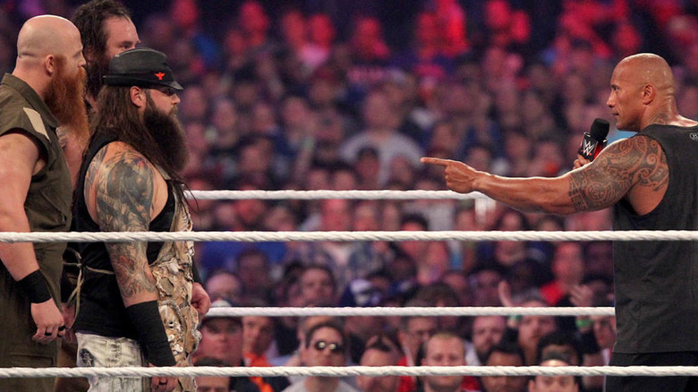 The Rock pointing at Bray Wyatt