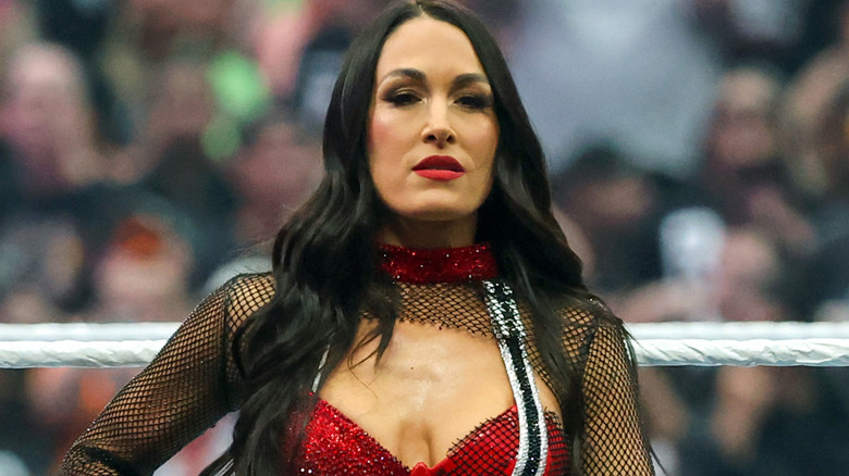 Brie Bella wearing a red top