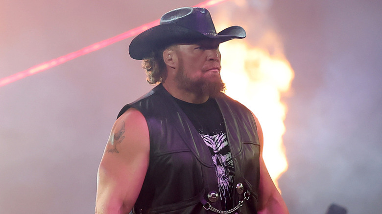 Brock Lesnar looking sad while wearing a cowboy hat