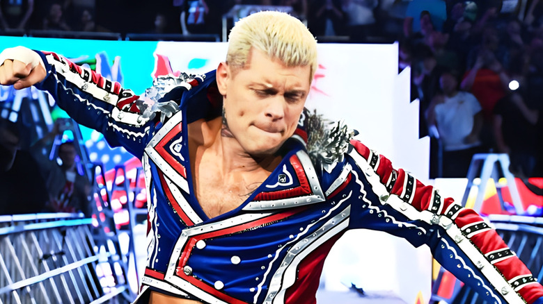 Cody Rhodes makes his entrance down the ramp before a match at a WWE premium live event.