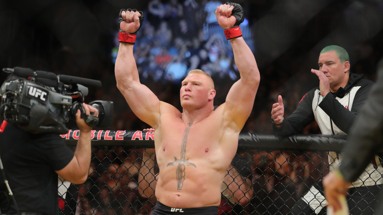 Brock Lesnar celebrating his win in the cage at UFC 200.