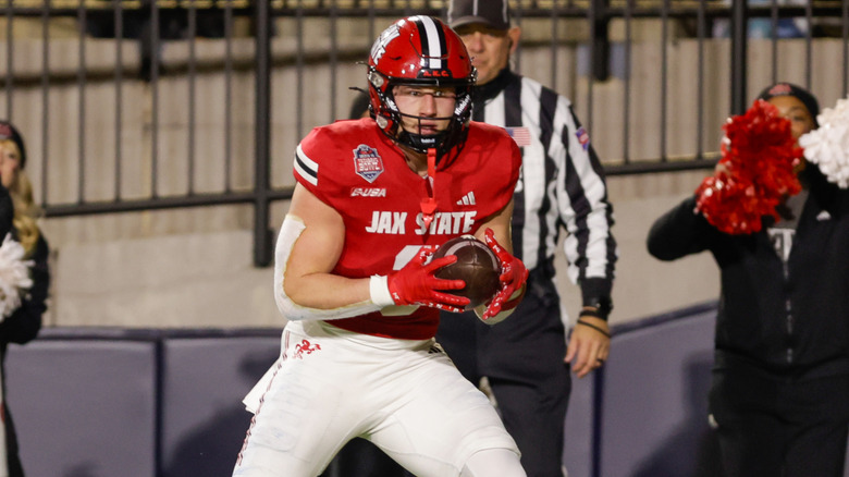 Brock Rechsteiner #3 of the Jacksonville State Gamecocks catches a pass for a touchdown against the Troy Trojans in the first half of the IS4S Salute To Veterans Bowl at Cramton Bowl on December 16, 2025 in Montgomery, Alabama.