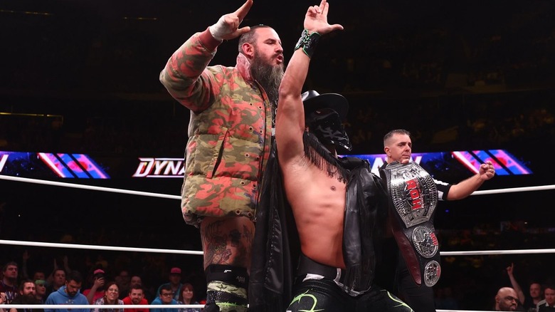 Brody King and Bandido are posing in the ring