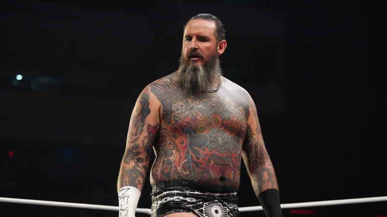 Brody King stands in the ring and prepares for a match on 