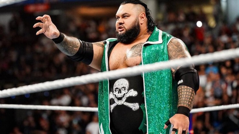 Bronson Reed poses in the middle of the ring before a match on WWE programming.