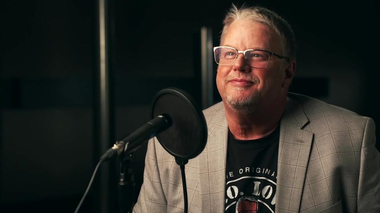 Bruce Prichard smiles during a podcast.