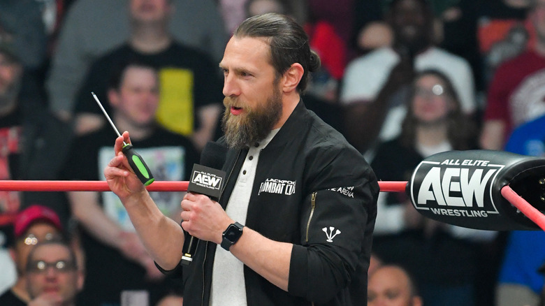 Bryan Danielson holding screwdriver