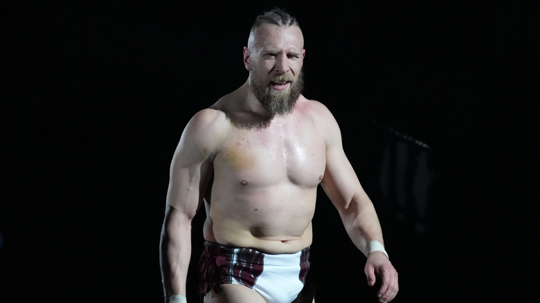 Bryan Danielson in a dark space with a bruise on his chest