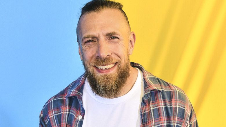 Bryan Danielson is wearing a plaid shirt