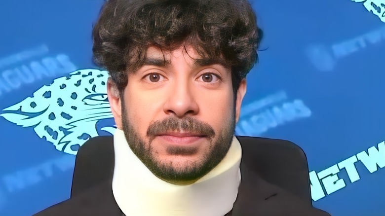 Tony Khan wearing a neck brace