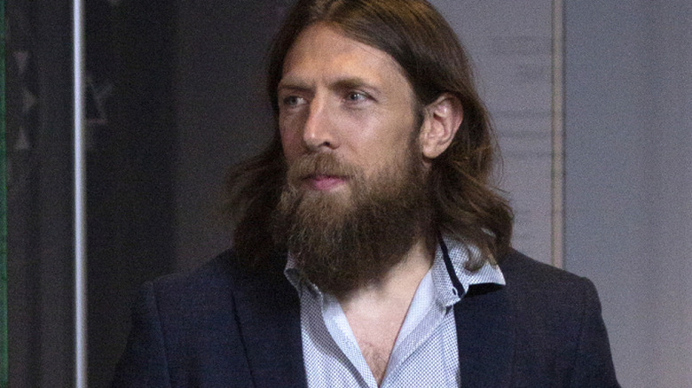 Bryan Danielson standing at a press event