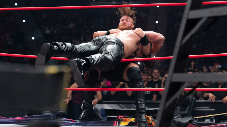 Buddy Matthews delivers a DDT to Andrade