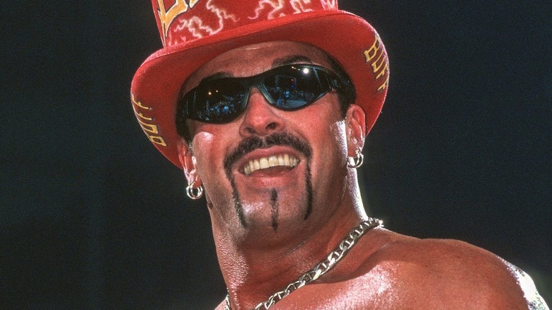 Buff Bagwell during his WCW run, smiling at the audience while in ring.