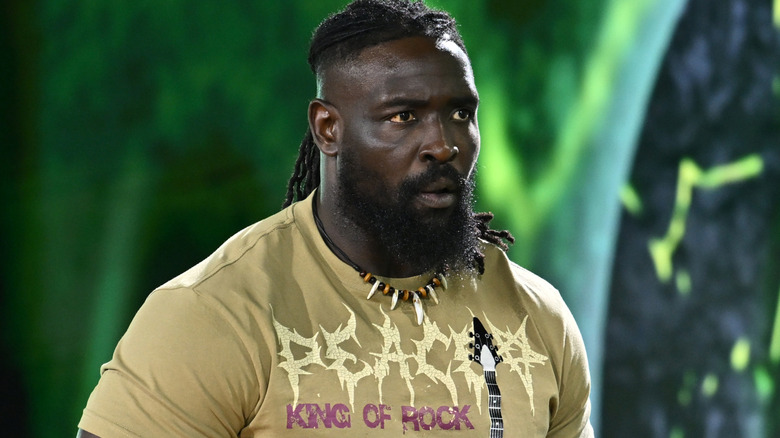 Oba Femi wearing a beige t-shirt