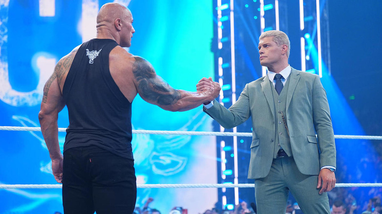 The Rock shakes hands with Cody Rhodes