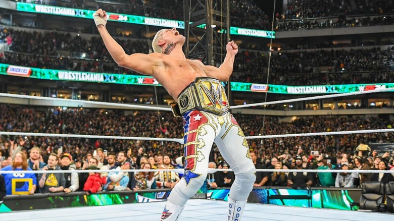 Cody Rhodes poses in victory with the Undisputed WWE Championship around his waist after defeating Roman Reigns at WrestleMania 40.