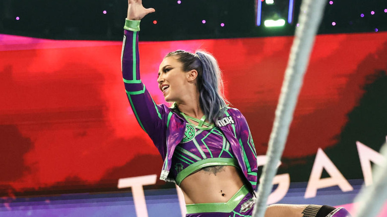 Tegan Nox posing on top turnbuckle