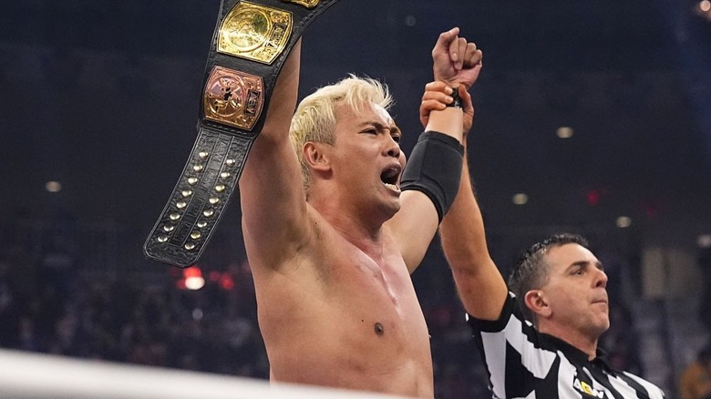 Kazuchika Okada holding up the AEW Continental Championship