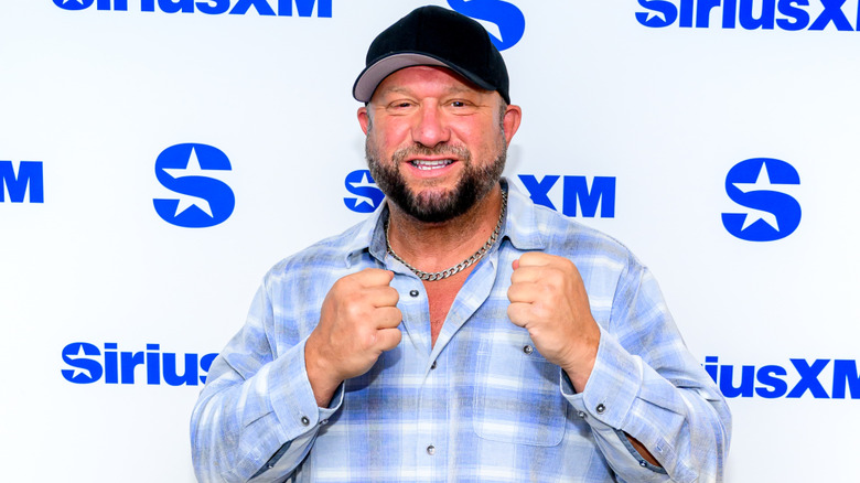 Bully Ray smiling with his fists raised