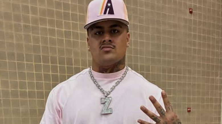 Zilla Fatu wearing a white t-shirt