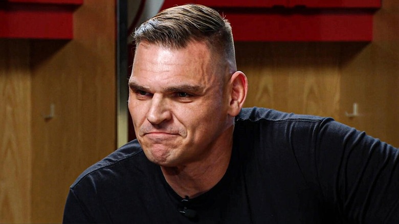 Gunther during a backstage interview with Michael Cole, threatening to end the veteran wrestling commentator and journalist's career. January 2026.