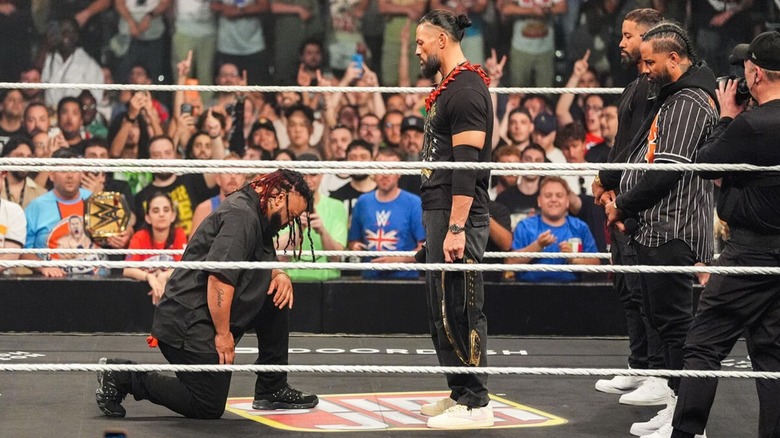 Jacob Fatu kneels before World Heavyweight Champion Roman Reigns, who is flanked by The Usos, during the acknowledgment ceremony on the June 1, 2026 edition of 