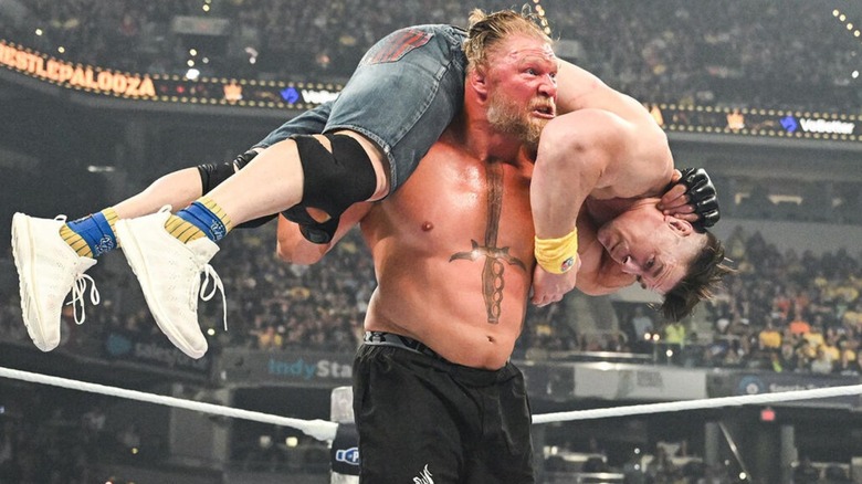 Brock Lesnar gets John Cena up on his shoulders for an F5 in the middle of the ring during their match at Wrestlepalooza.