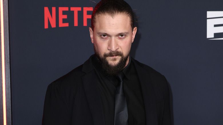 Karrion Kross wearing a black suit