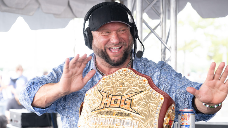 Bully Ray smiling with his hands up in front of the HOG Crown Jewel Championship