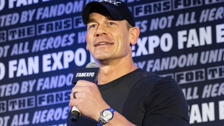 John Cena is holding a microphone