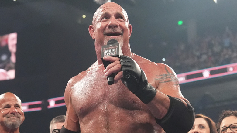 Goldberg holding a microphone