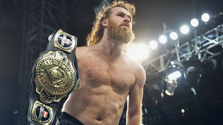 Sami Zayn holding the Intercontinental Championship