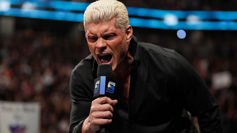 Cody Rhodes talking into a microphone