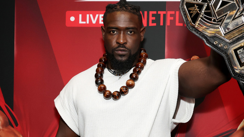 Oba Femi wearing a white t-shirt