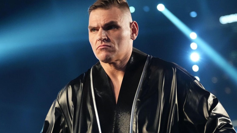 GUNTHER stares toward the audience as he stands in the ring before his match against AJ Styles at WrestleMania.