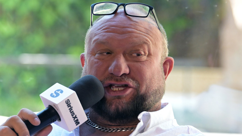 Bully Ray wearing a necklace and glasses on top of his head