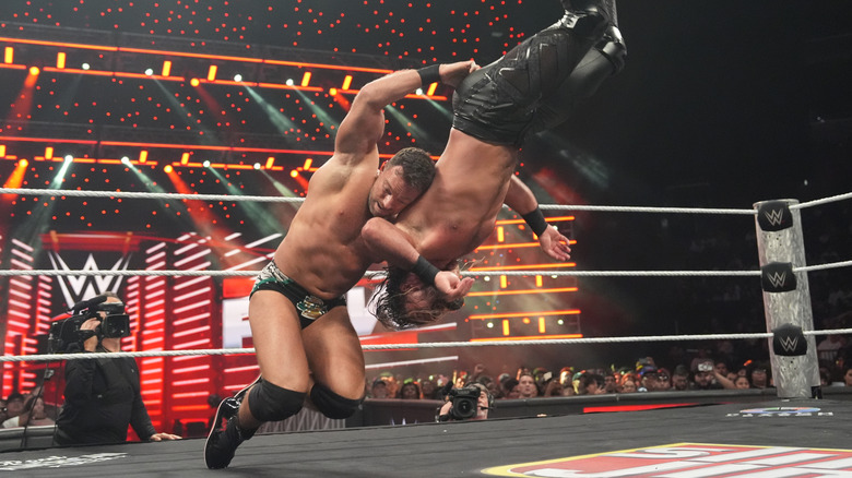 LA Knight and Seth Rollins in action during their recent clash on 