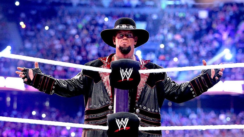 The Undertaker makes his iconic entrance.