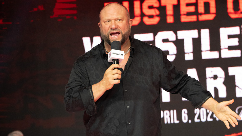 Bully Ray speaking into a mic at a Busted Open event