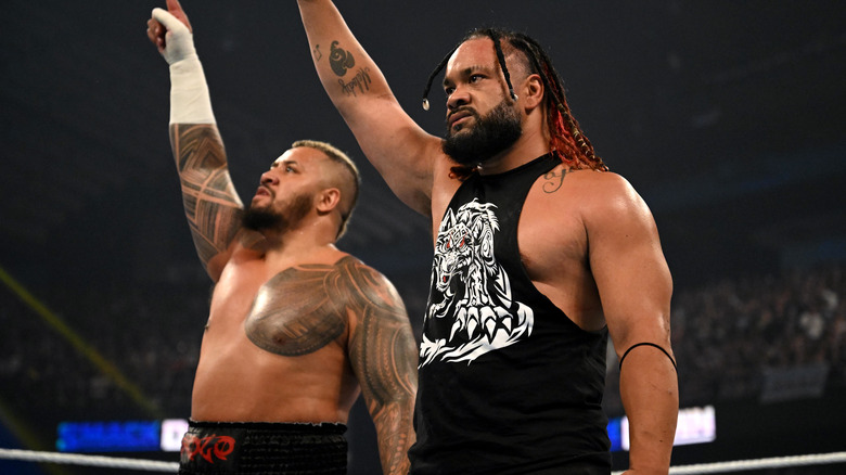 Jacob Fatu and Solo Sikoa raising their arms