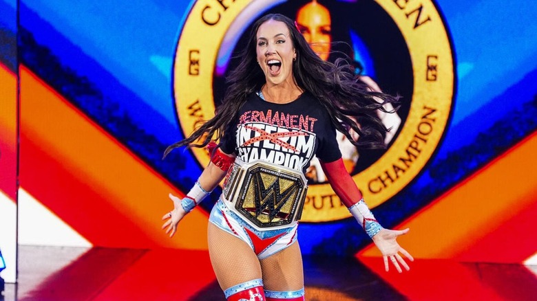 WWE Women's Champion Chelsea Green makes her way down to the ring, title around her waist, for her victory