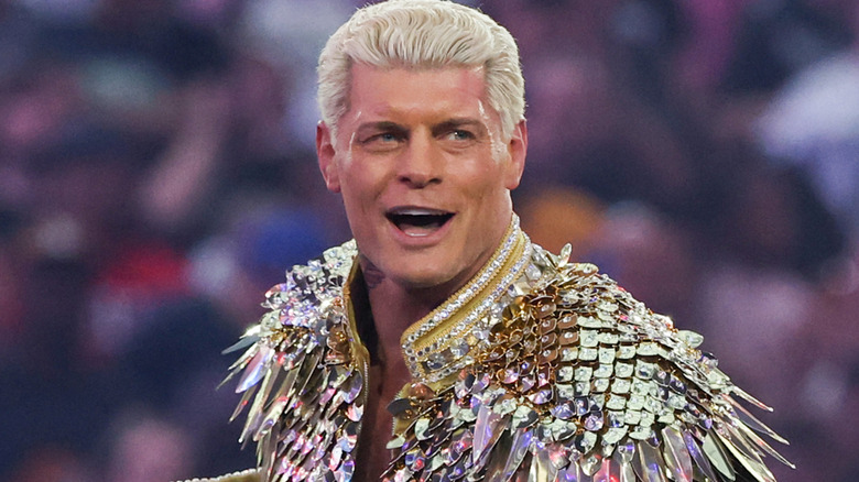 Cody Rhodes wearing a gold jacket