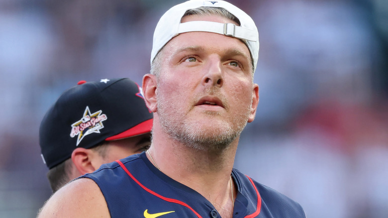 Pat McAfee wearing a backwards hat