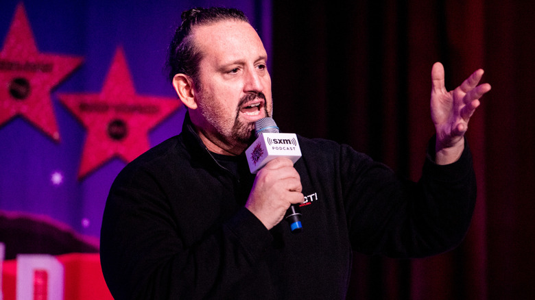 Tommy Dreamer speaks to an audience at a "Busted Open Radio" live event