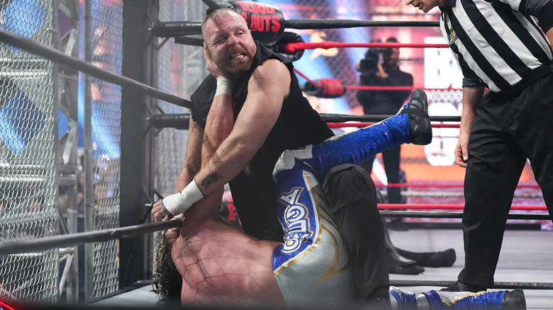 Jon Moxley goes after Kenny Omega inside Blood & Guts